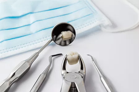 A dental hygiene kit with a toothbrush and toothpaste on a white background.