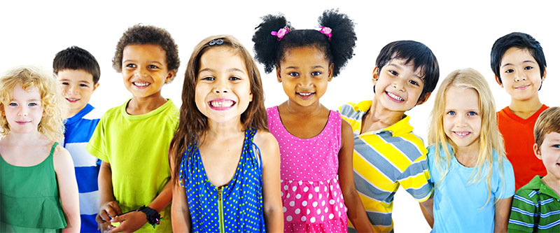 A diverse group of children and adults posing together in a colorful photo.